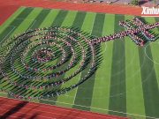 Cina: Yunnan, studenti eseguono la danza del piede sinistro